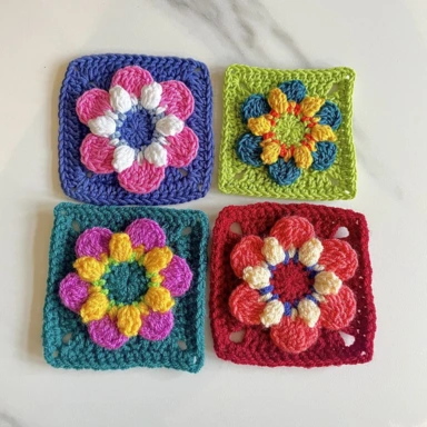 A set of 4 Pop Flower crochet granny squares in bright colours