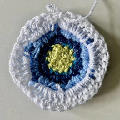 Round 6 -  pale blue crochet granny square  - starting white border