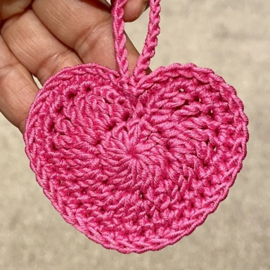 finished pink crochet heart with hanging loop