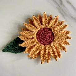 Crochet sunflower and crochet leaf